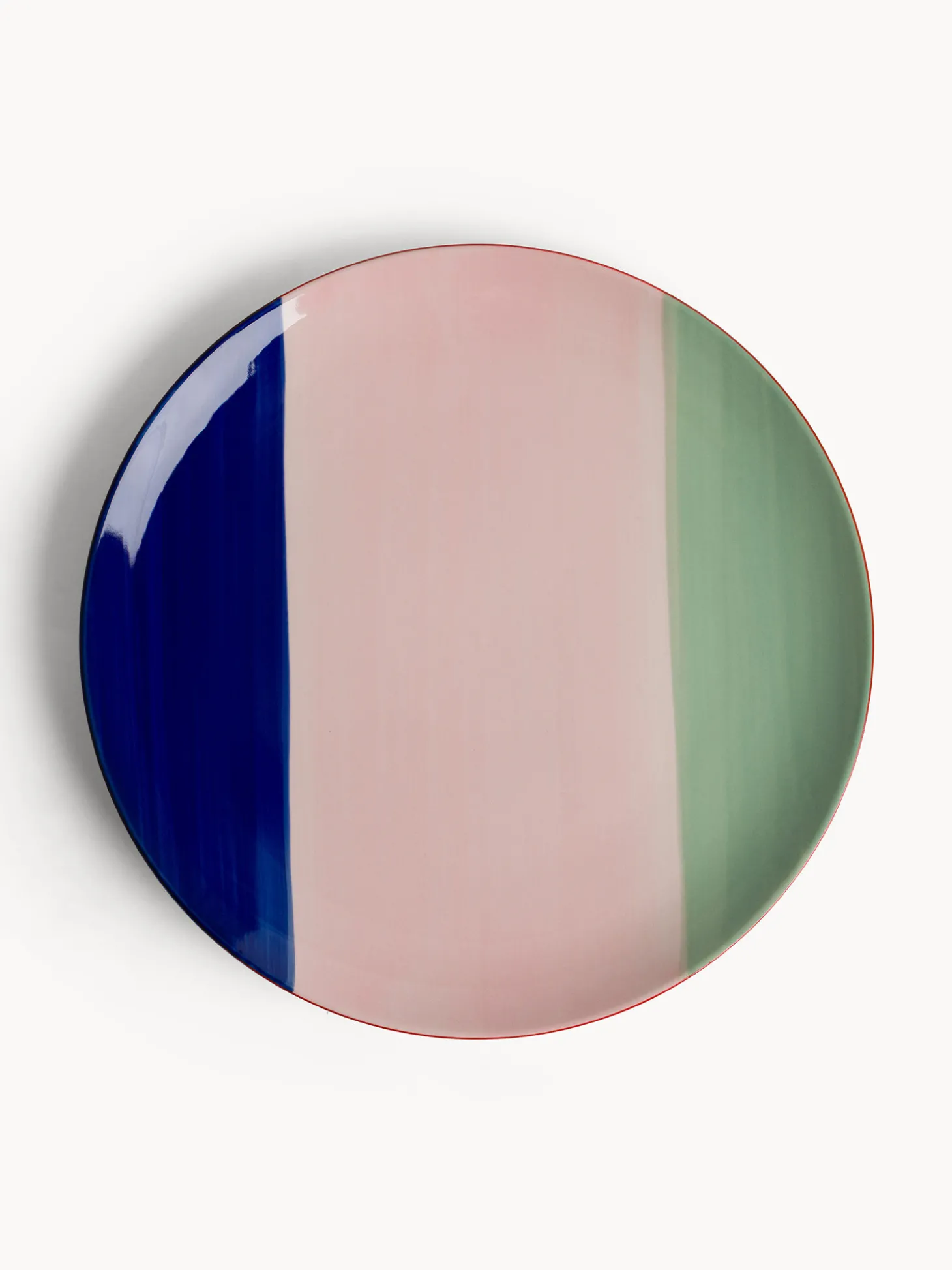 Piatto piano in ceramica a righe colorate